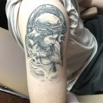 The Art Behind a Detailed Black and Grey Jesus Tattoo